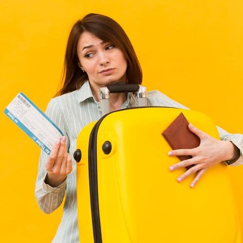 Shopper holding bags against a yellow background, representing consumer behaviour and changing prices.